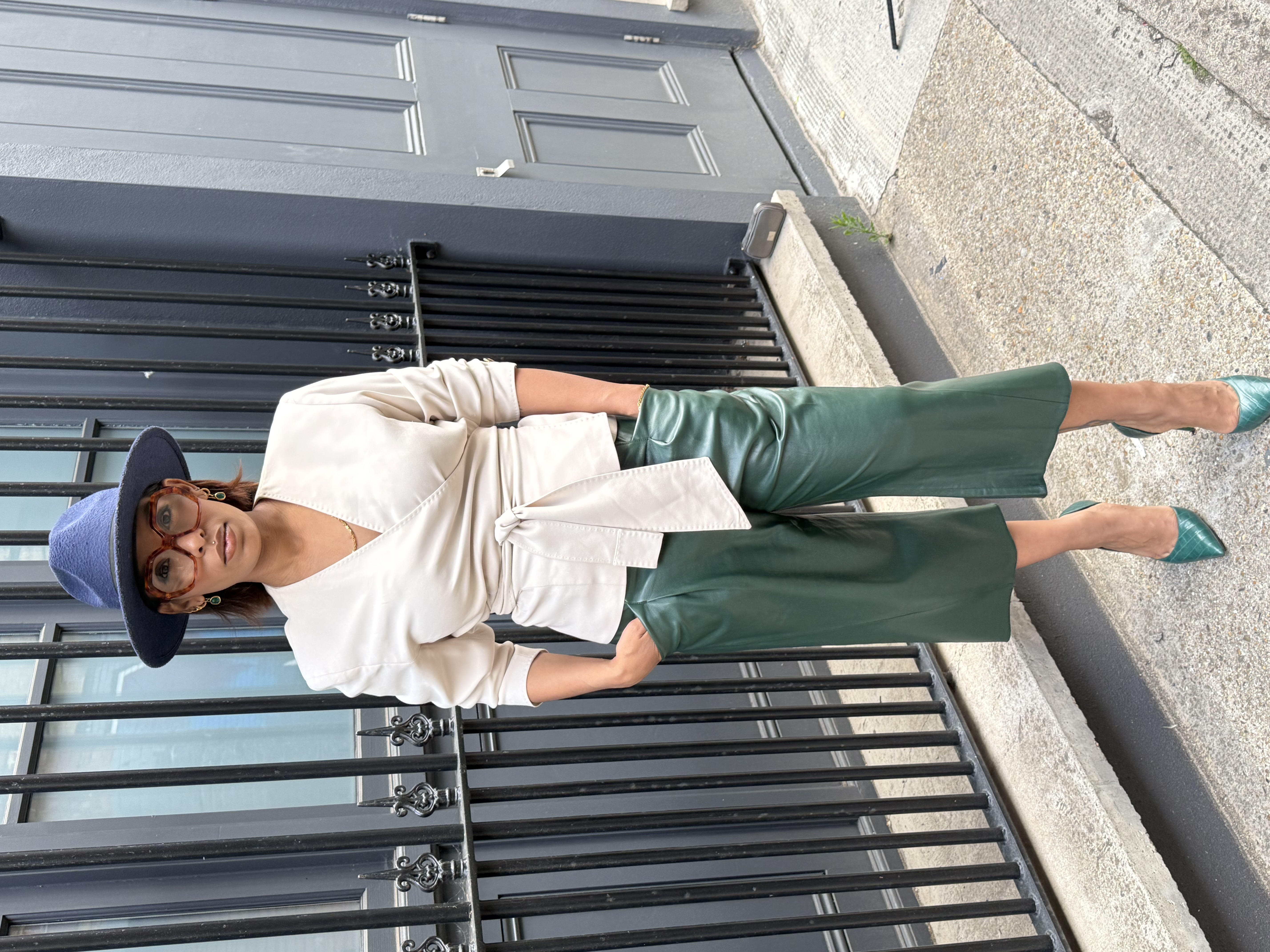 Aahliyah wearing a blue hat and green trousers